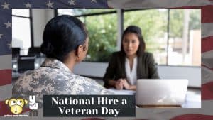 Female veteran in uniform sitting at a desk in an interview for National Hire a Veteran Day